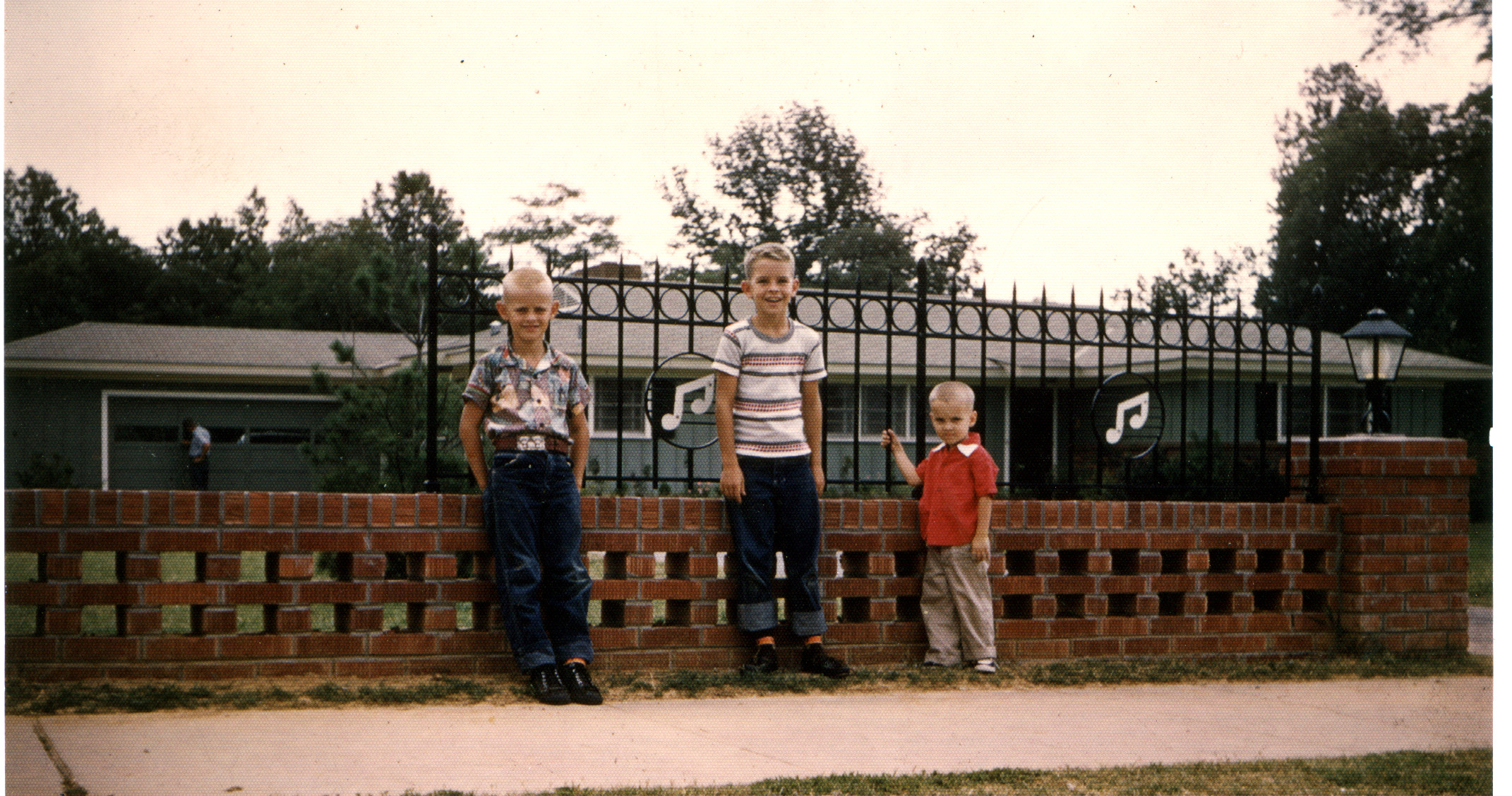 Sanders brothers outside of Elvis's first home on Audobon Drive Memphis